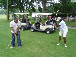 Renee Powell helps Bernardo perfect his golf swing!