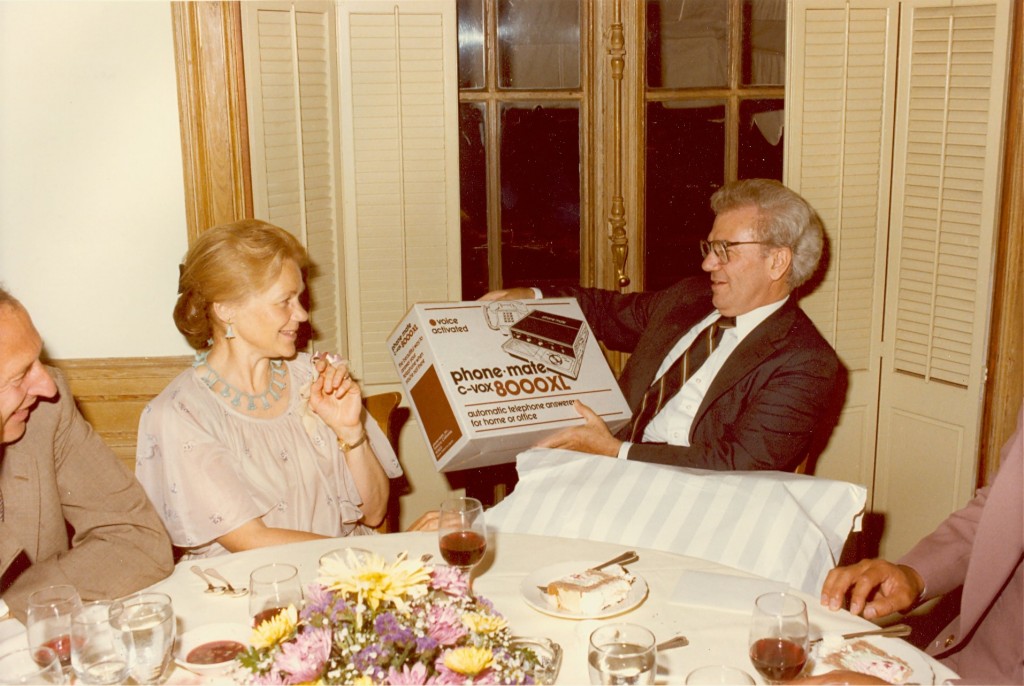 Ernest L. and Kay Boyer opening a gift at a "Dinner with the Deputies" event in Washington, DC. - BCA